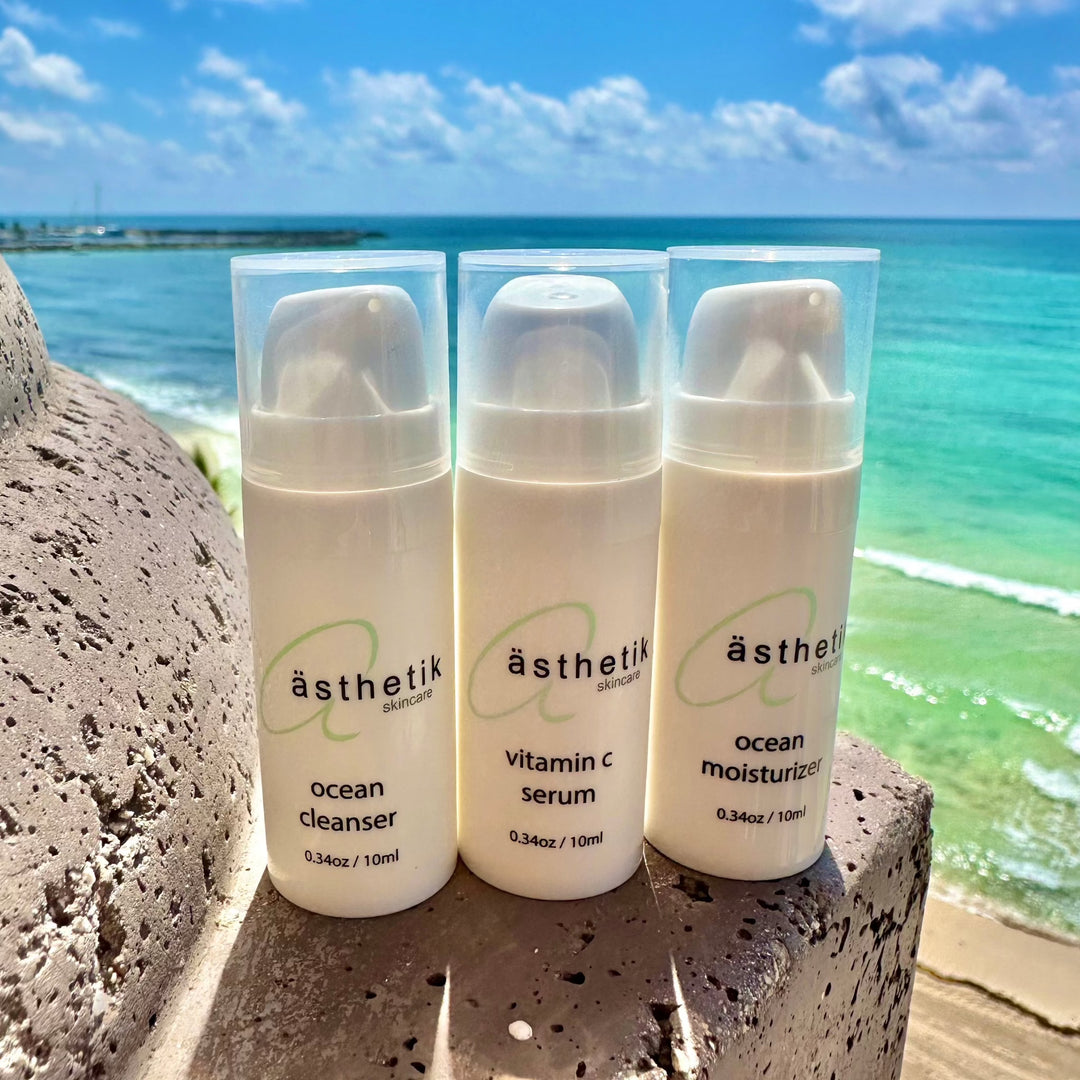 travel sized skincare at beach on rocks