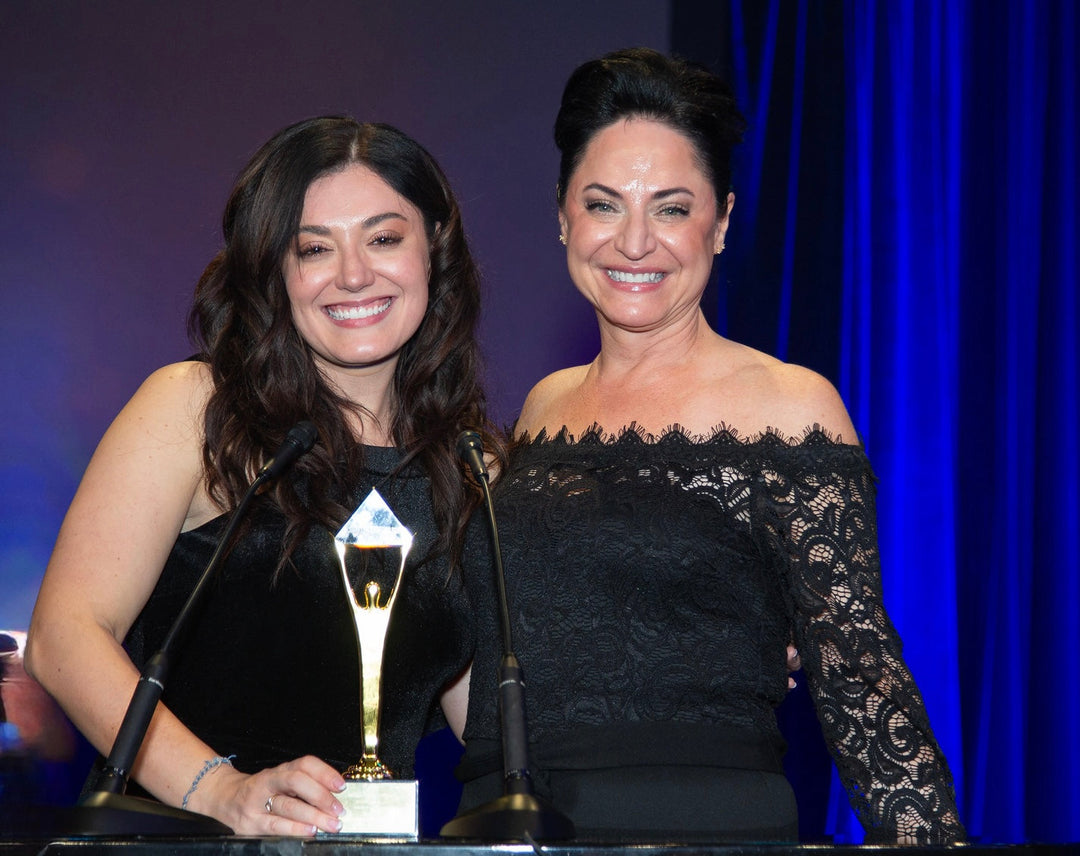 Alexis and Jennifer Pfropper owners of ästhetik skincare receiving a 2024 Stevie Award