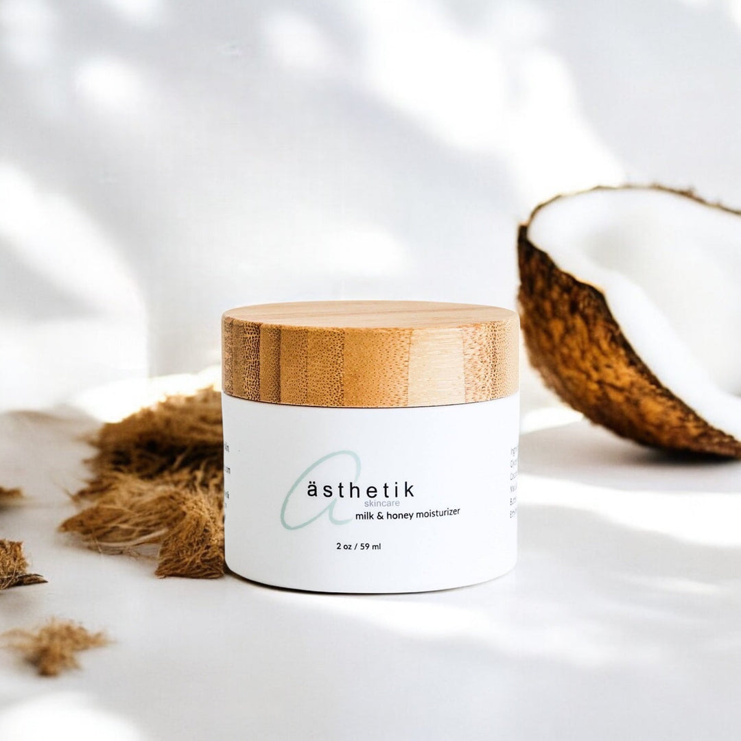 ästhetik skincare milk and honey moisturizer with coconut in the background