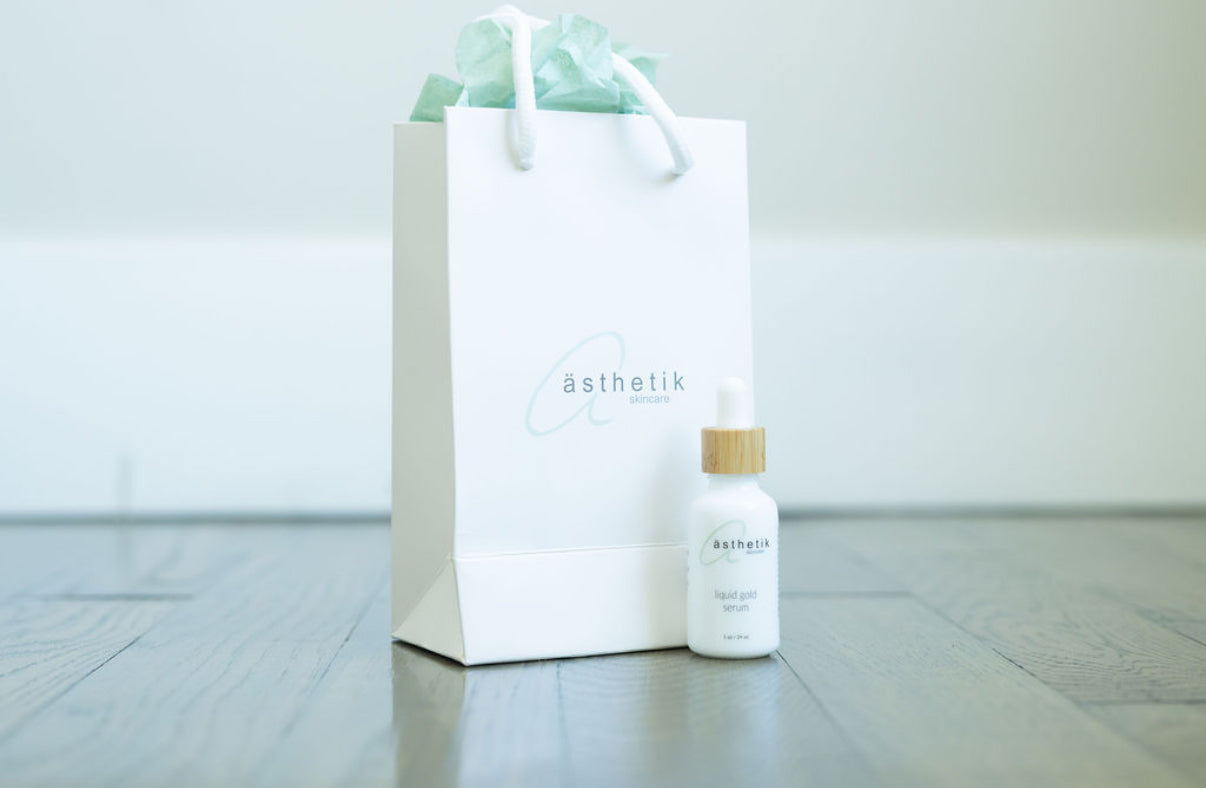 asthetik skincare liquid gold serum and gift bag