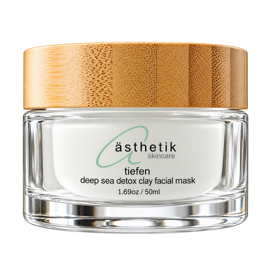 A 50ml glass jar of asthetik skincare 'tiefen' deep sea detox clay facial mask, featuring a textured light brown bamboo wood lid and a white label with green and black text.