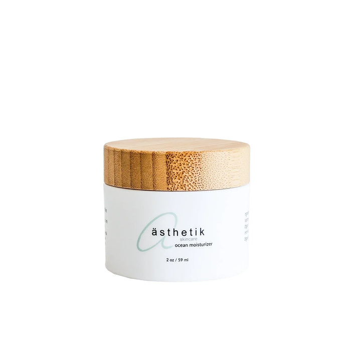 ästhetik skincare ocean moisturizer in a white jar with a bamboo lid
