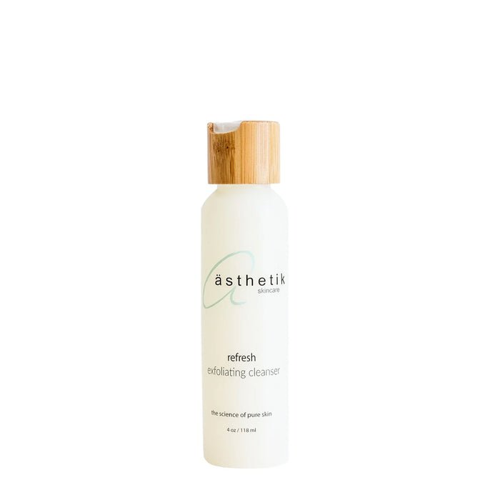ästhetik skincare Refresh Exfoliating Cleanser in a white bottle with a bamboo cap.
