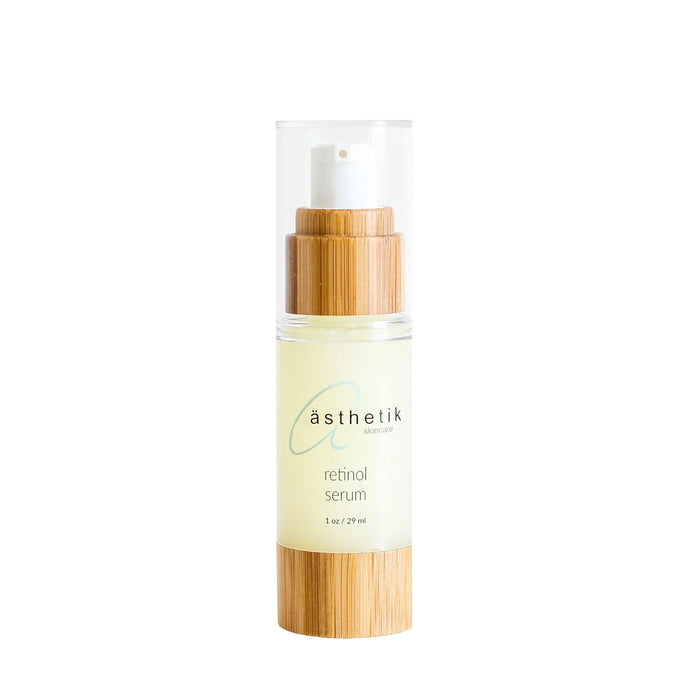 ästhetik skincare retinol serum in a clear bottle with a bamboo cap and base