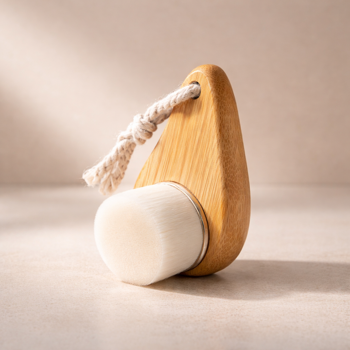 Wooden brush with a white base on a beige background