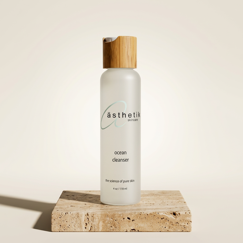 Skincare bottle labeled 'asthetik' on a beige background