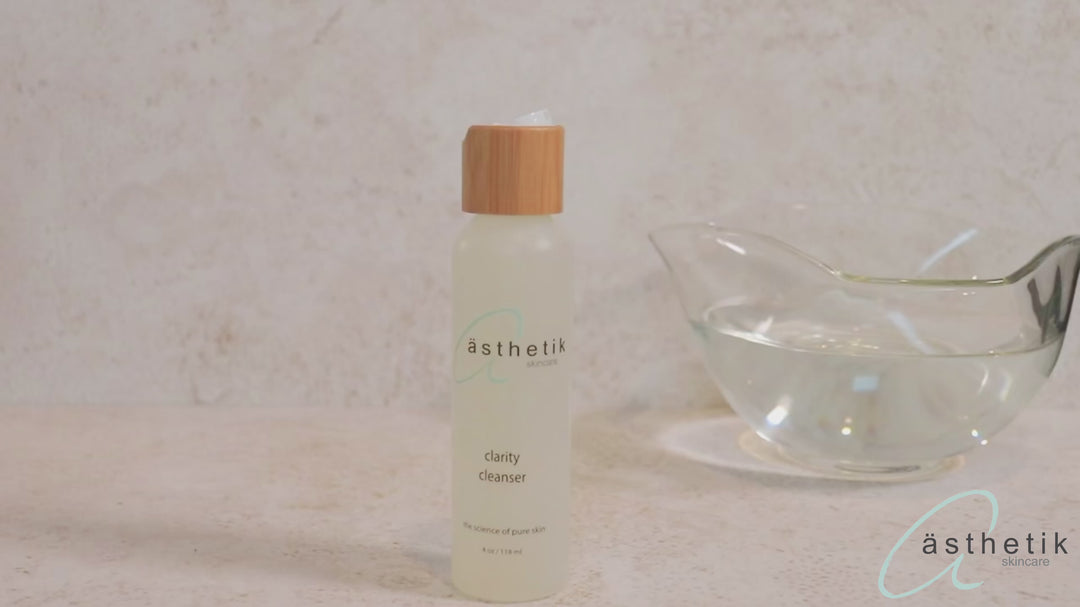 person using the clarity cleanser from asthetik skincare