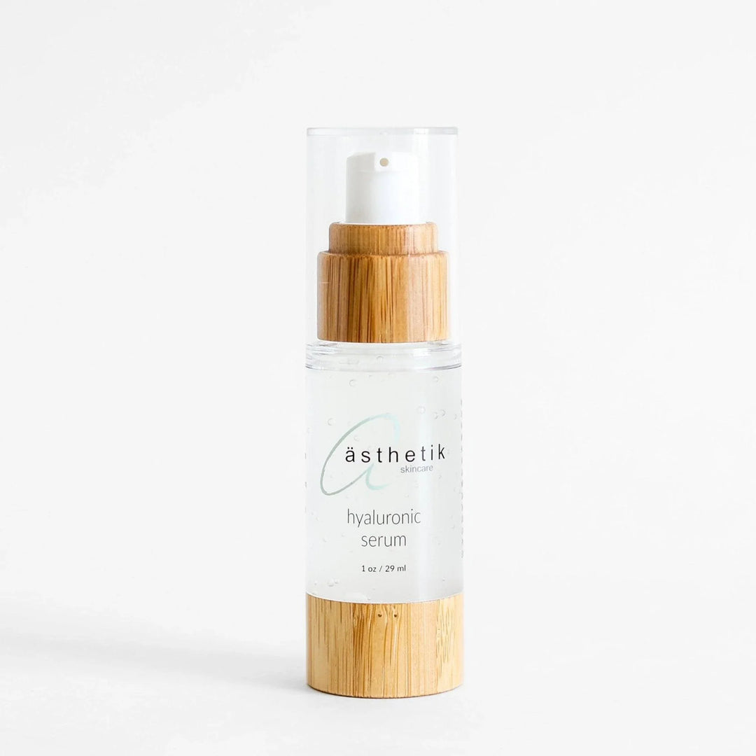 Hyaluronic acid serum from ästhetik skincare in a glass bottle with a bamboo lid