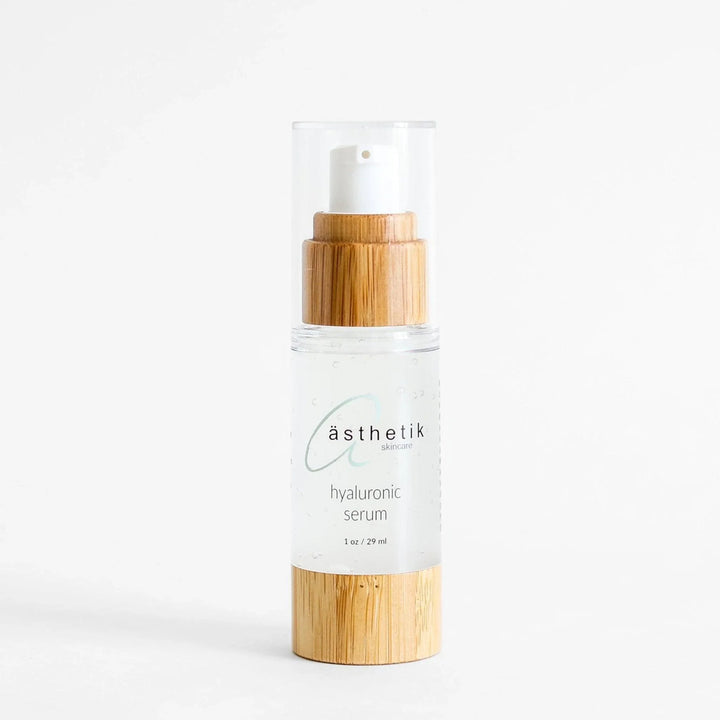 Hyaluronic acid serum from ästhetik skincare in a glass bottle with a bamboo lid