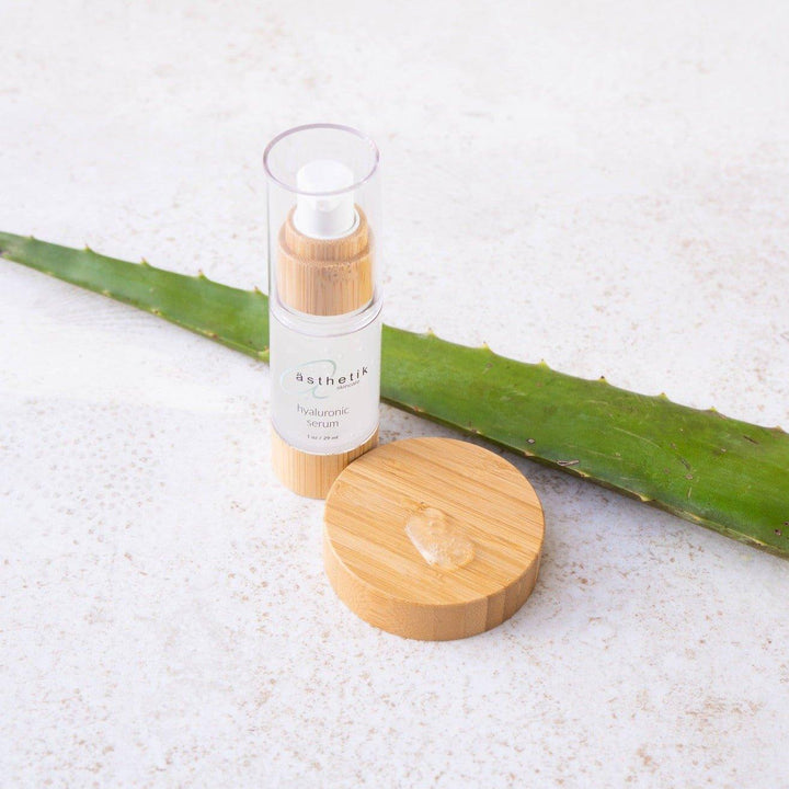 Refreshing asthetik hyaluronic acid serum on natural aloe vera leaf